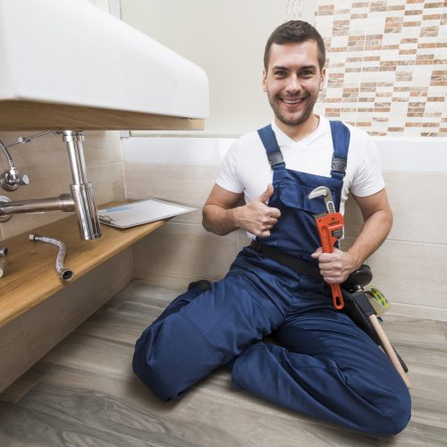 smiling-sanitary-technician-gesturing-thumb-up